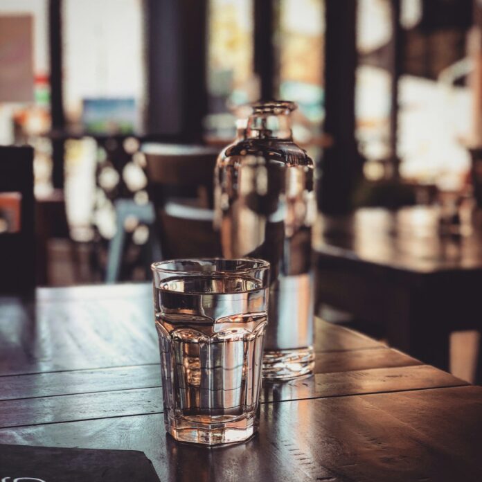Photo by Clint McKoy clear drinking glass on table